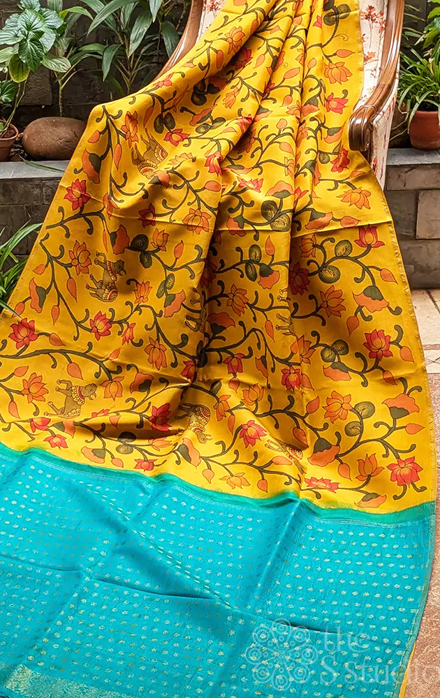 Mango yellow pen kalamkari kanchi silk saree with hand painted with pichwai motifs and aqua blue pallu (Pre-order available)
