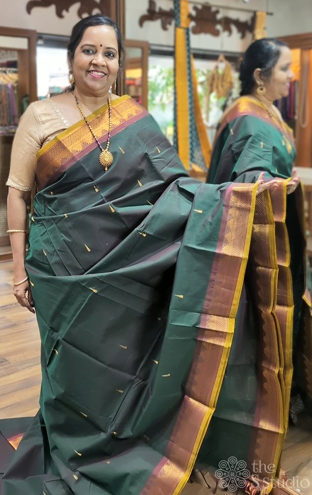 Bottle green handwoven kanchi cotton saree with maroon border and grand pallu