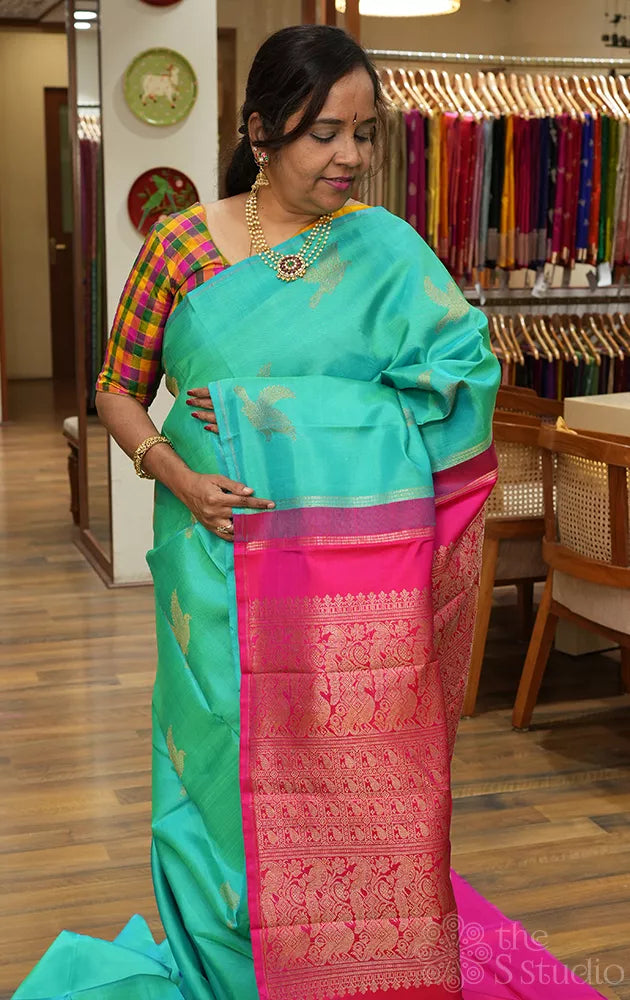 Bluish green colour kanchipuram silk saree with bird motifs