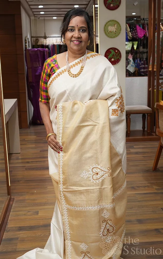 Off white and golden tissue kanchipuram silk saree with kutch embroidery