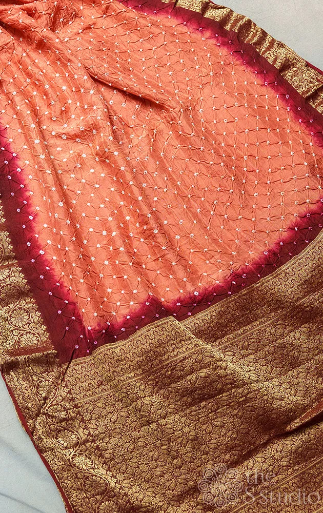 Orange bandhani silk saree with maroon banarasi pallu