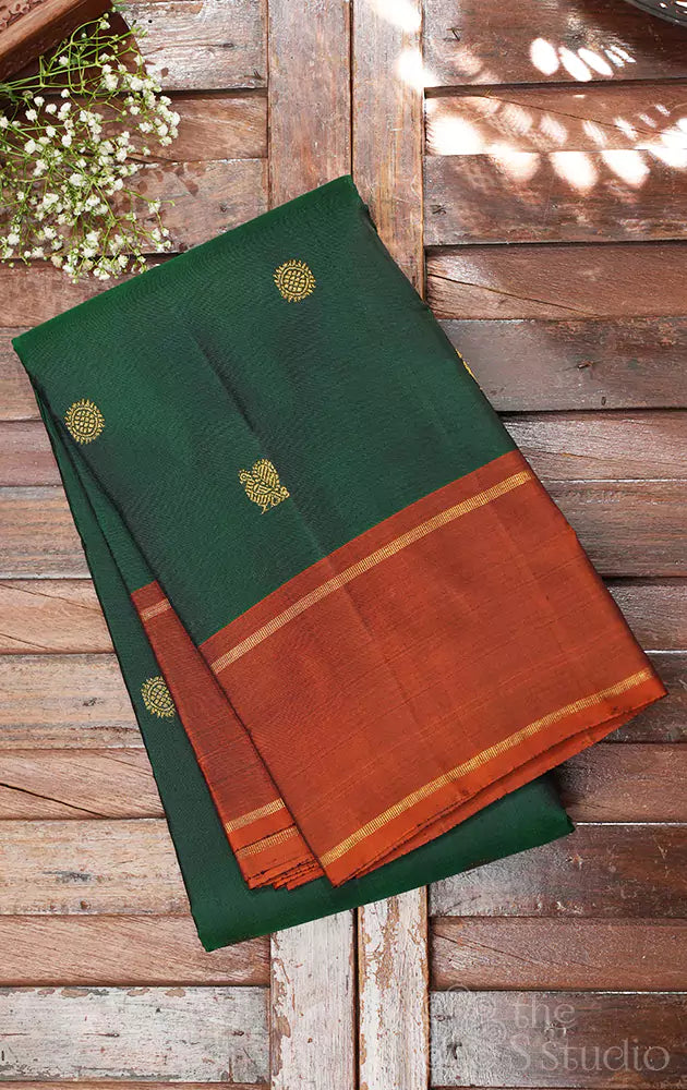 Green kanjivaram silk saree with rust border