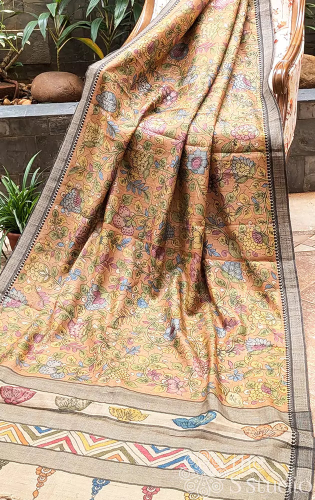 Light orange hand painted kalamkari tussar silk saree with black border