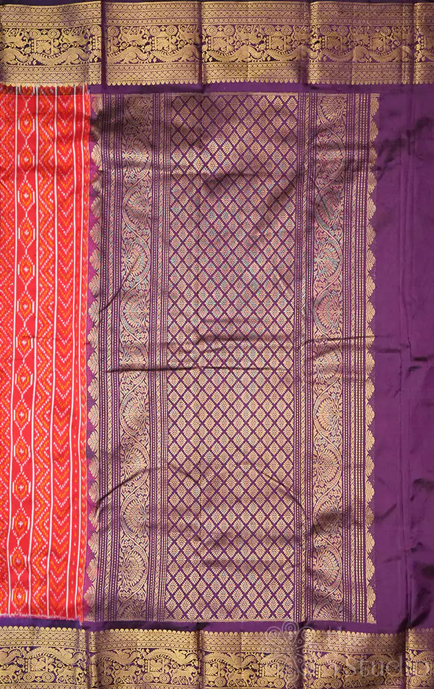 Red ikat silk saree with purple kanchi style zari border