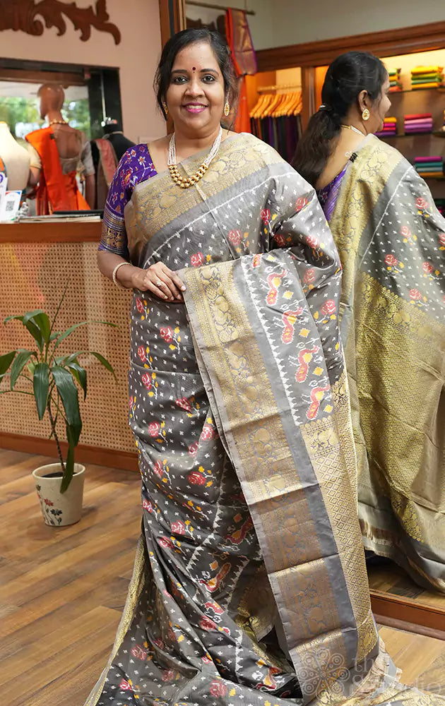 Grey ikkat silk saree with rich zari border