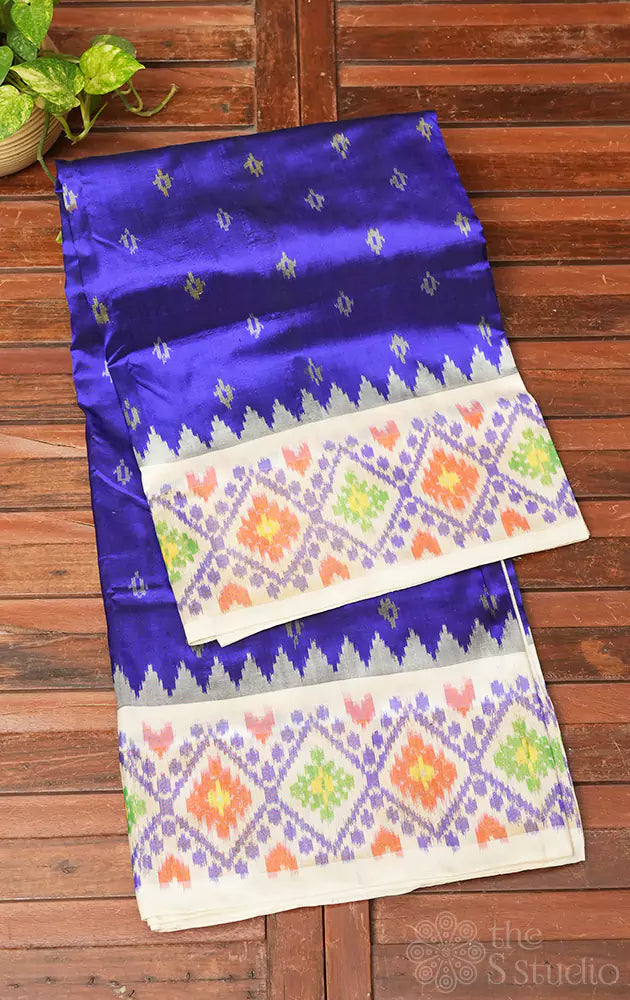 Blue ikkat silk saree with off white zari border
