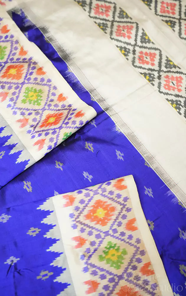 Blue ikkat silk saree with off white zari border
