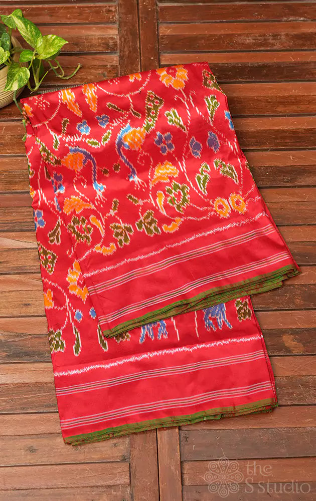 Red ikkat silk saree in forest theme with green selvedge
