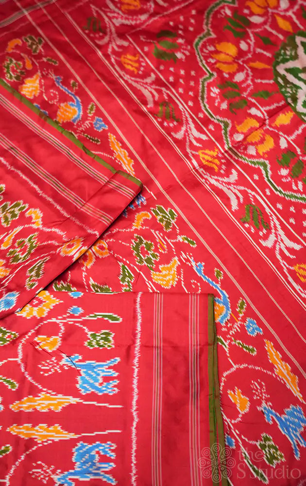 Red ikkat silk saree in forest theme with green selvedge