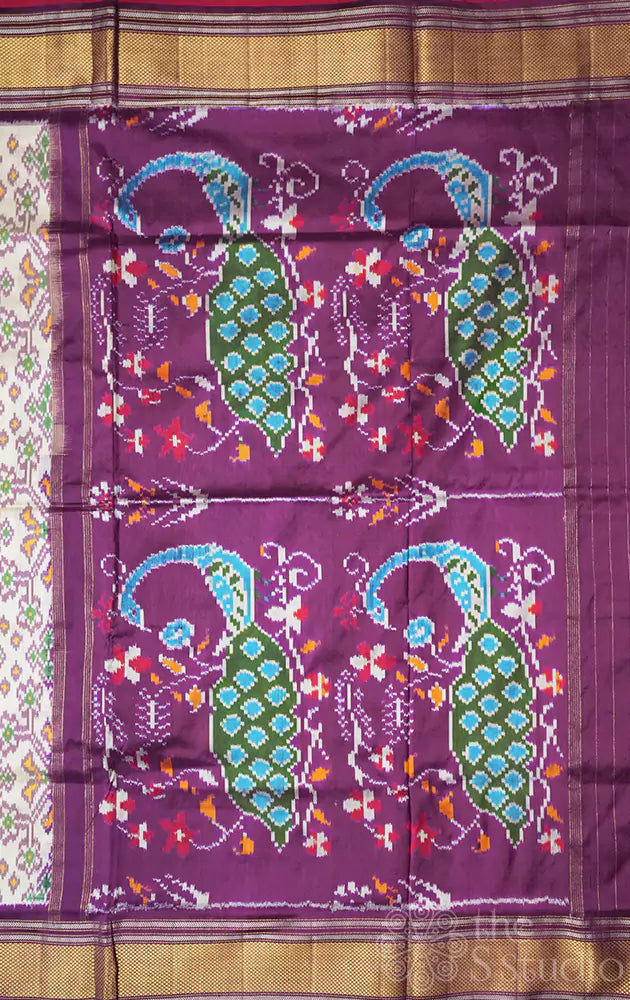 Off white and  purple ikkat silk saree with zari border