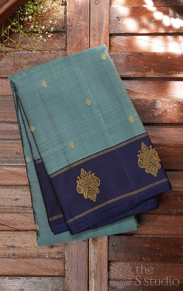 Light blue kanjivaram silk saree with peacock buttas border