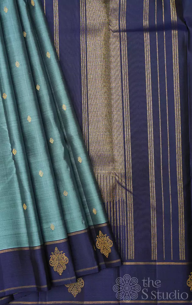 Light blue kanjivaram silk saree with peacock buttas border