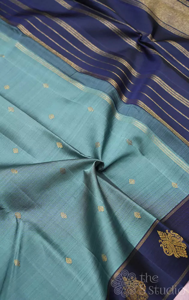Light blue kanjivaram silk saree with peacock buttas border