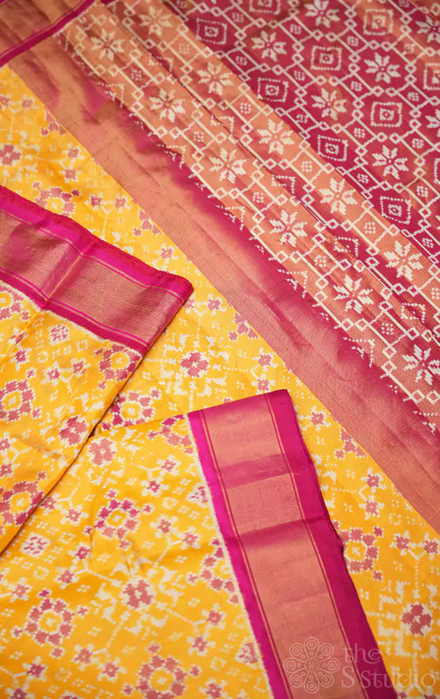 Yellow tissue ikkat silk saree with rani pink border
