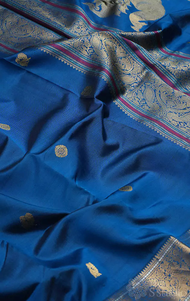 Peacock blue kanchi silk saree with mayil chakaram buttas