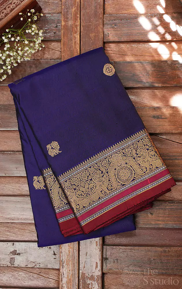 Violet kanchi silk saree with mayil chakaram buttas