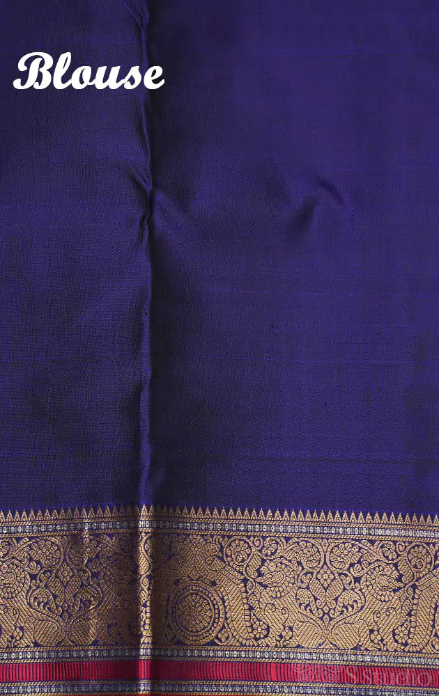 Violet kanchi silk saree with mayil chakaram buttas