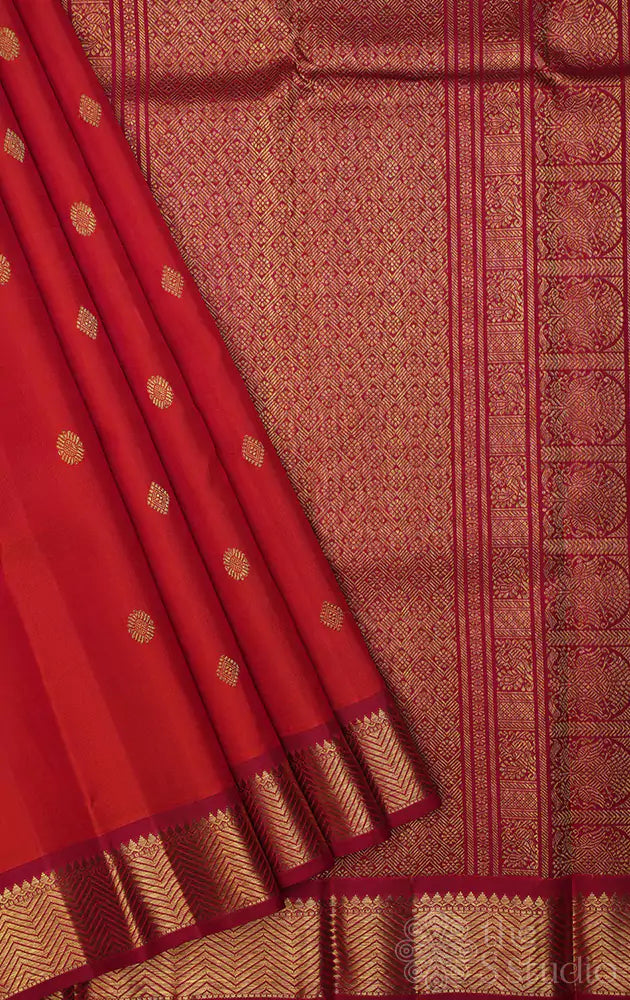 Rust kanchi pattu saree with small maroon border