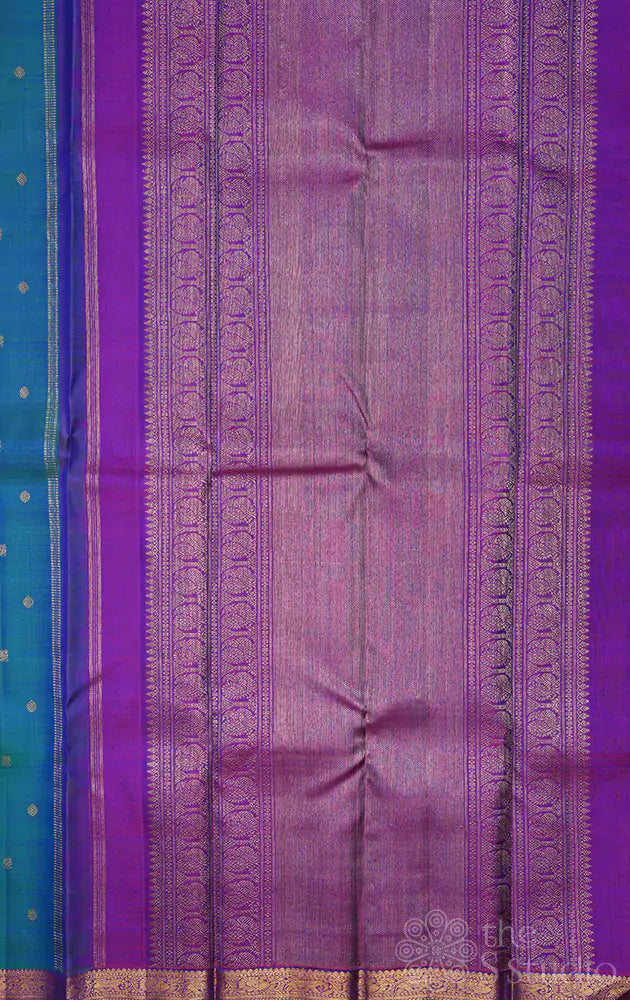 Peacock blue kanchi pattu saree with purple pallu