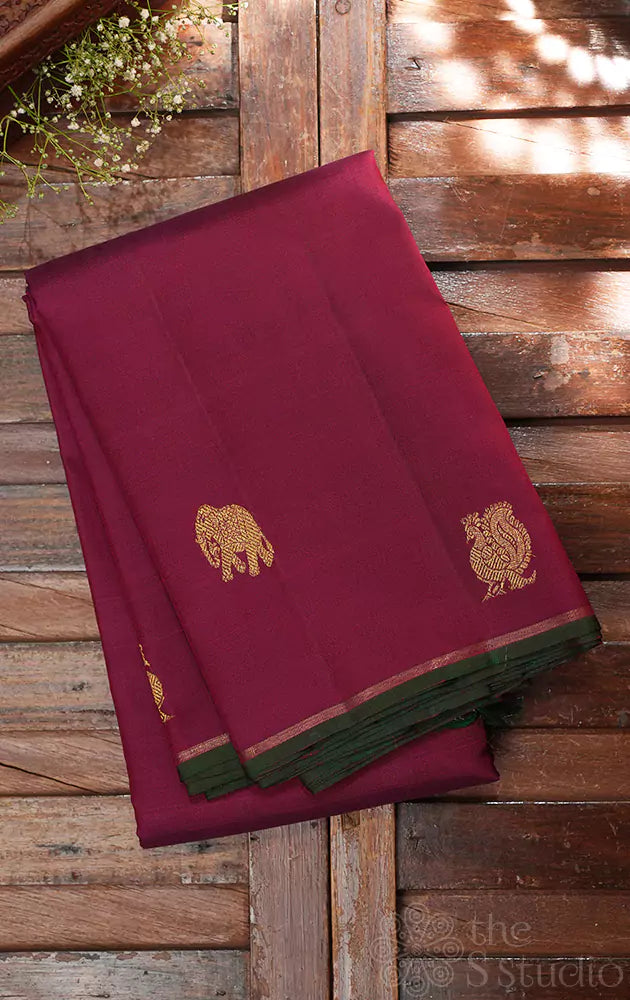 Maroon kanchipuram silk saree with border buttas