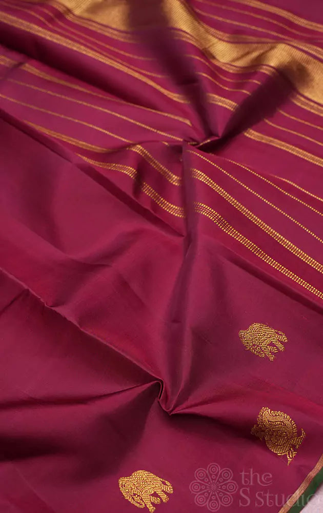 Maroon kanchipuram silk saree with border buttas