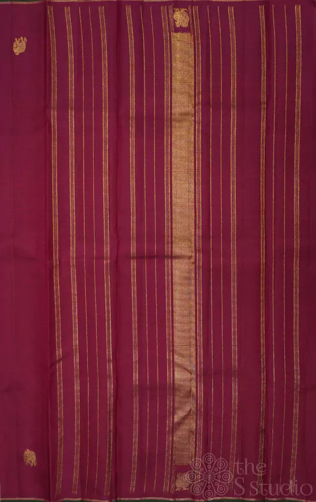 Maroon kanchipuram silk saree with border buttas