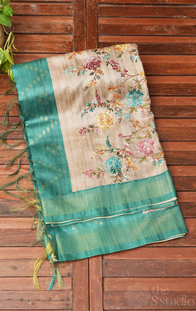Beige semi tussar saree with floral embroidery