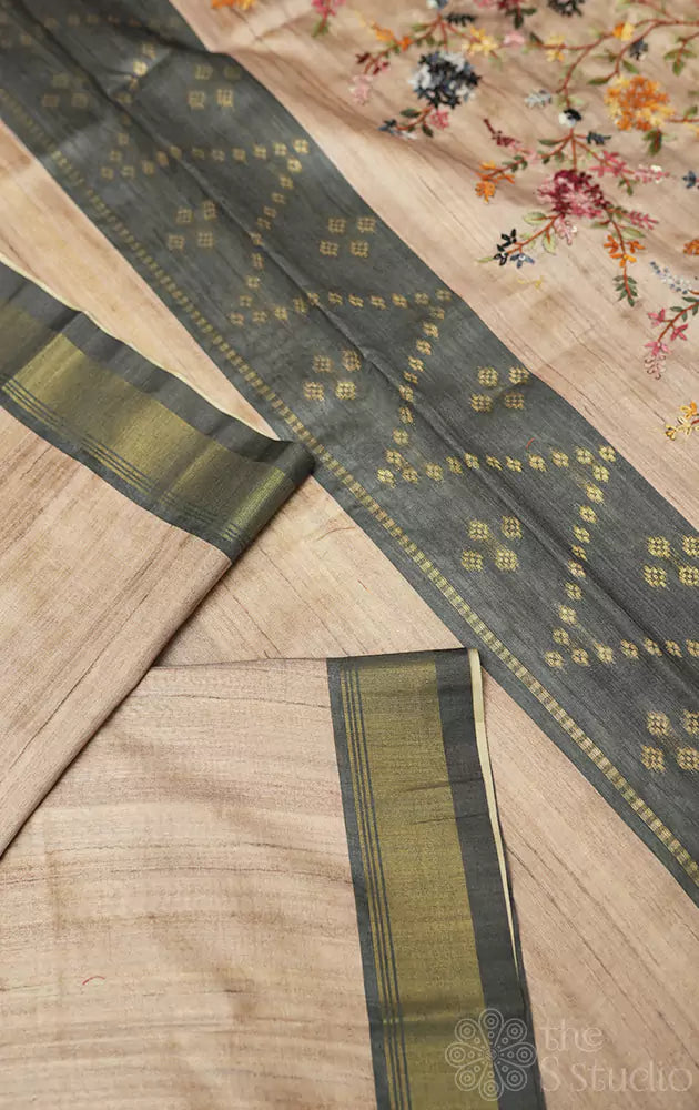 Beige semi tussar saree with floral embroidery on pallu