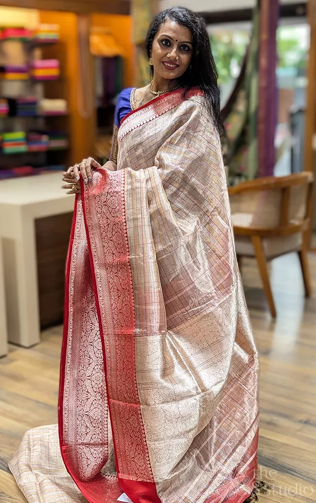 Beige checked banarasi tissue silk saree with red border