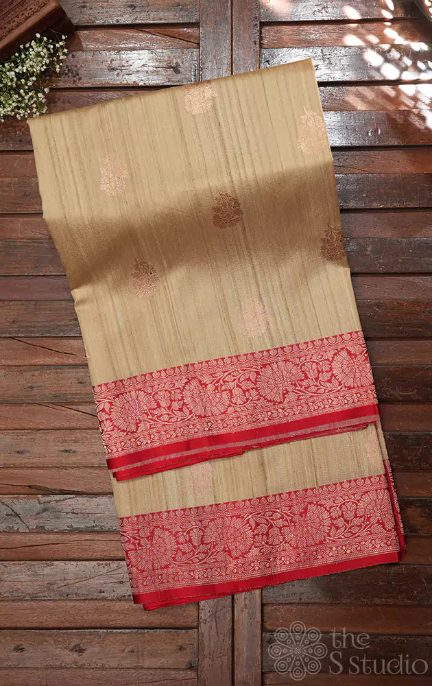 Beige handwoven tussar banarasi silk saree with red zari border