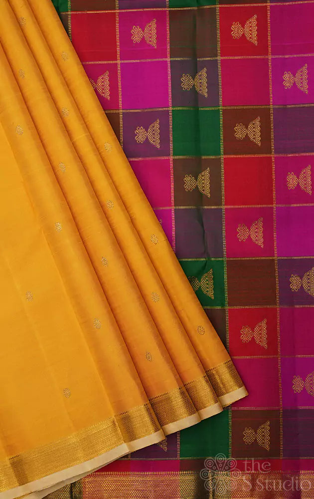 Yellow kanchi silk saree with paalum pazhamum checks pallu and blouse