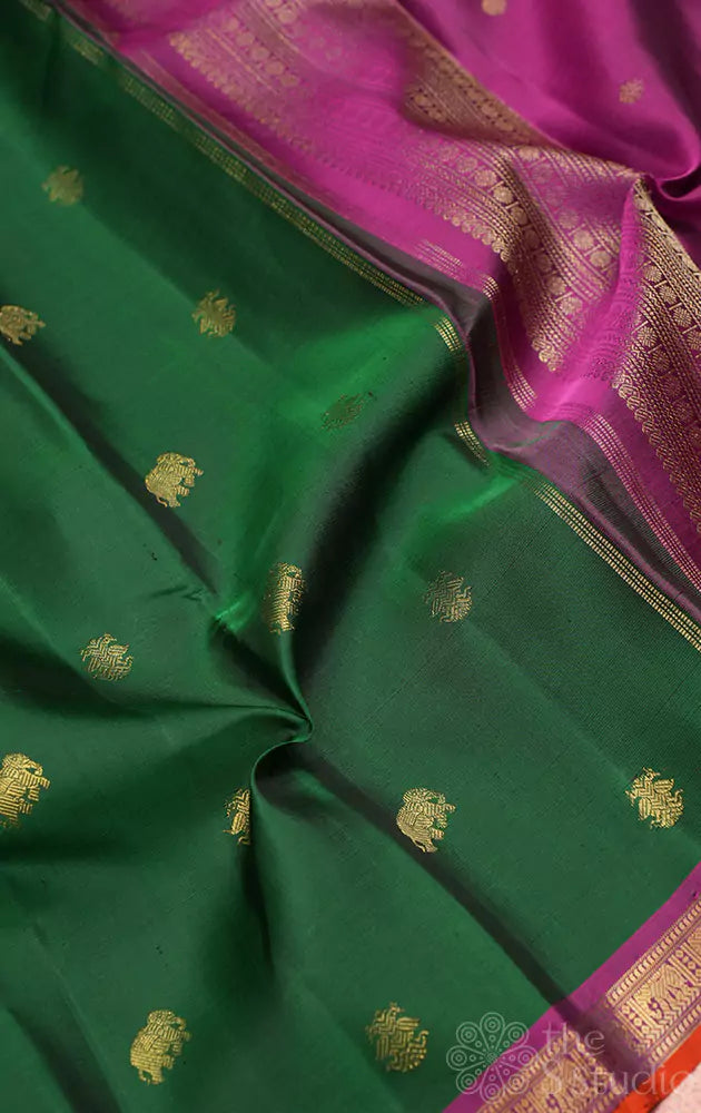 Dark green kanchipuram silk saree with small border