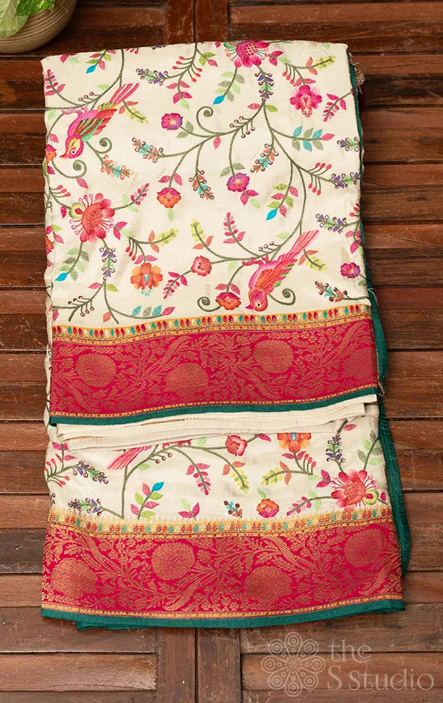 Off white semi crepe banarasi silk saree with embroidery and red border