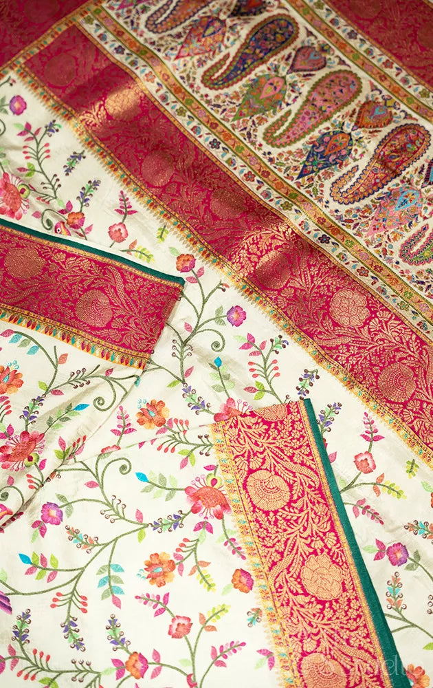 Off white semi crepe banarasi silk saree with embroidery and red border