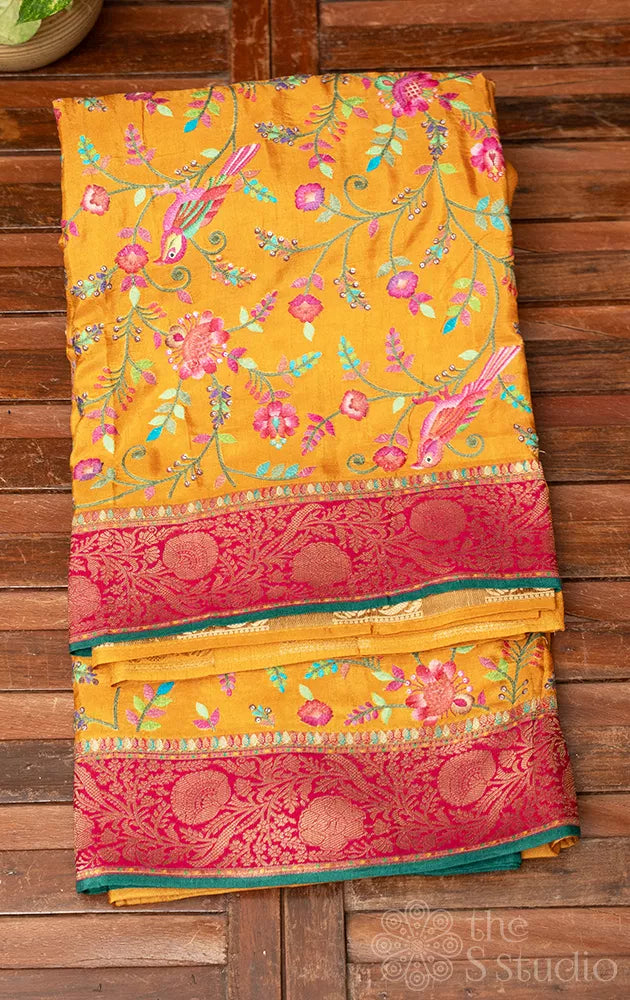 Mustard semi  crepe banarasi silk saree with floral and bird embroidery 