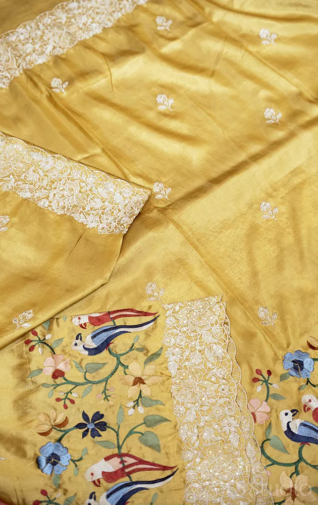 Light yellow semi banarasi silk saree with bird embroidery