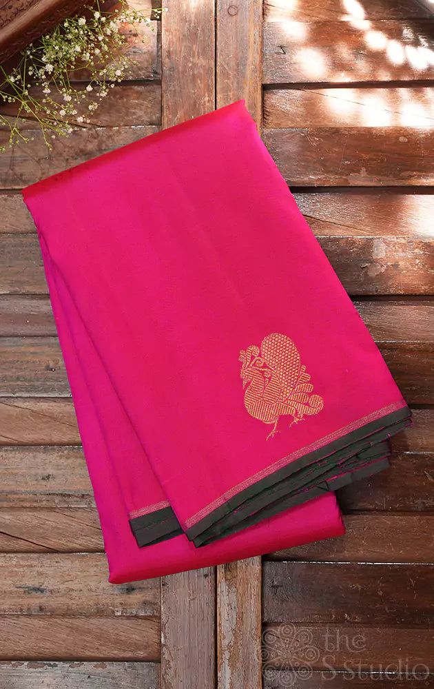 Rani pink kanjivaram saree with peacock border buttas