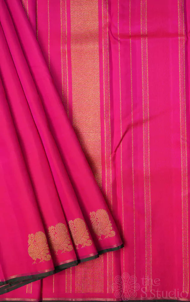 Rani pink kanjivaram saree with peacock border buttas