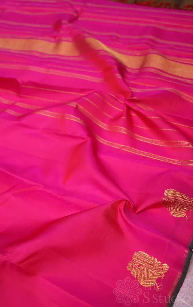 Rani pink kanjivaram saree with peacock border buttas