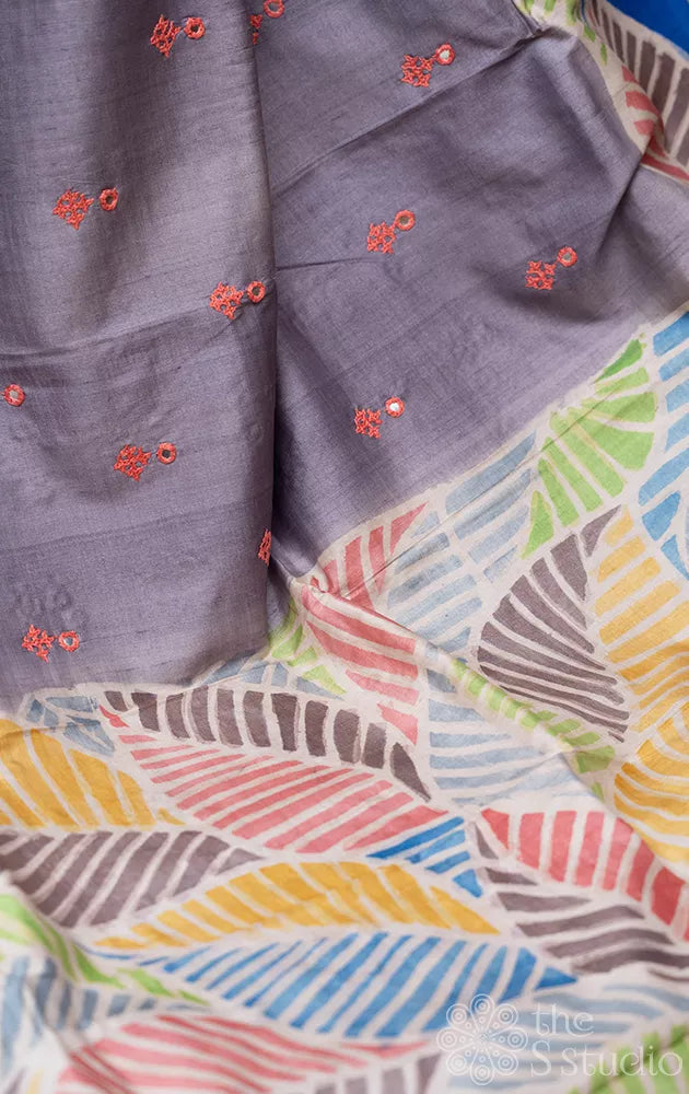 Grey tussar silk saree with hand-painted leaf designs and kutch embroidery