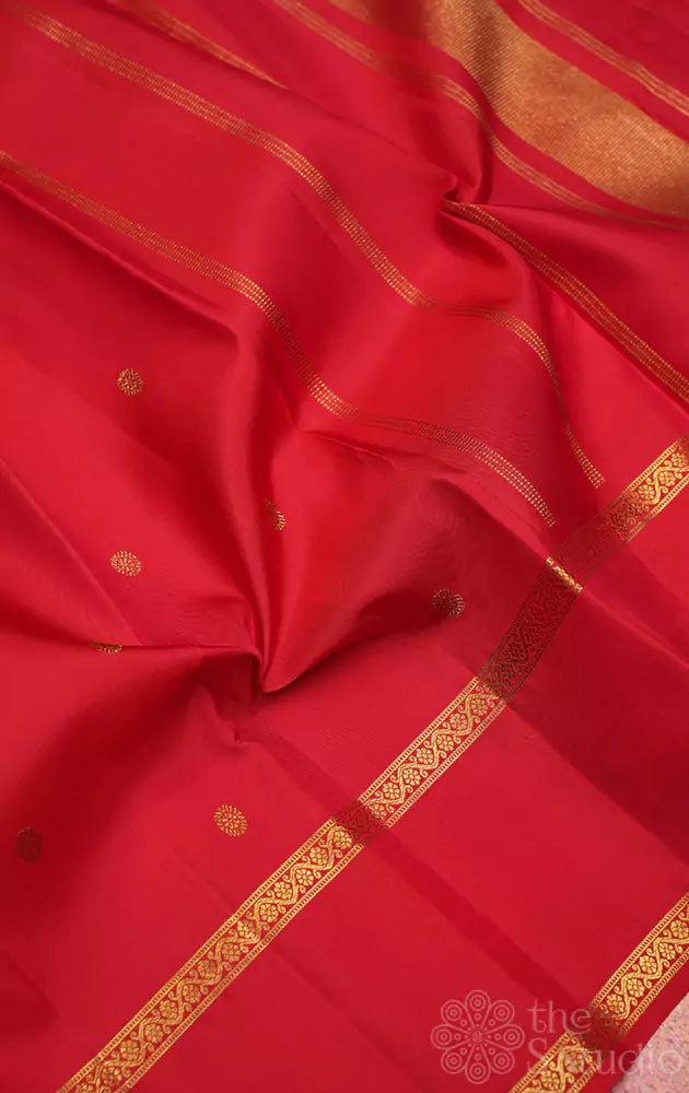 Red kanchi silk saree with small buttas and rettai pet border