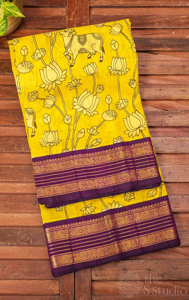 Lemon yellow silk cotton saree with pichwai prints & korvai border