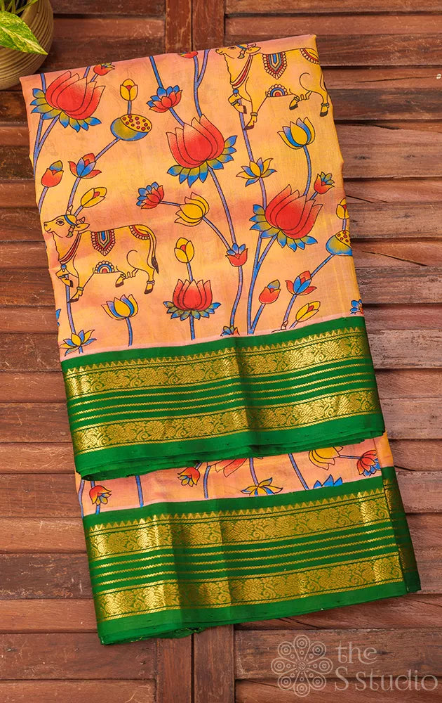 Light peach silk cotton saree with green rettaipet border