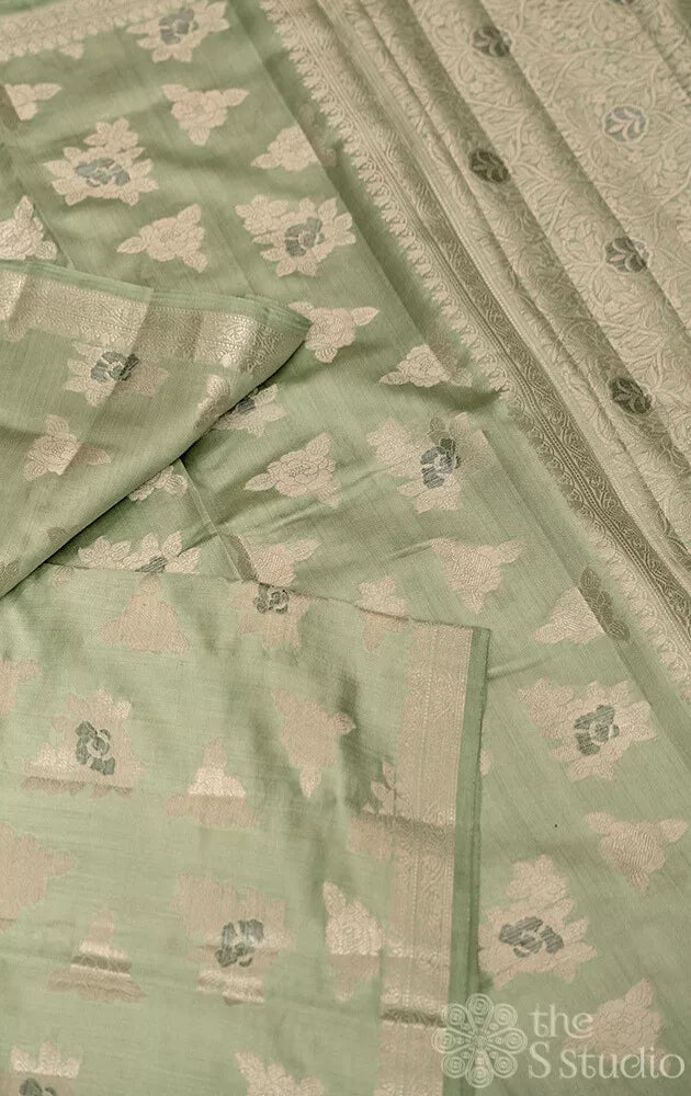 Light moss green chiniya banarasi silk saree with silver zari buttas