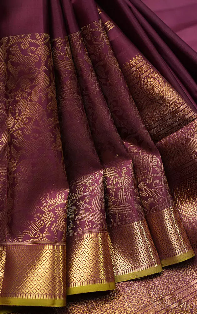 Brown kanjivaram silk saree with vanasinghram border