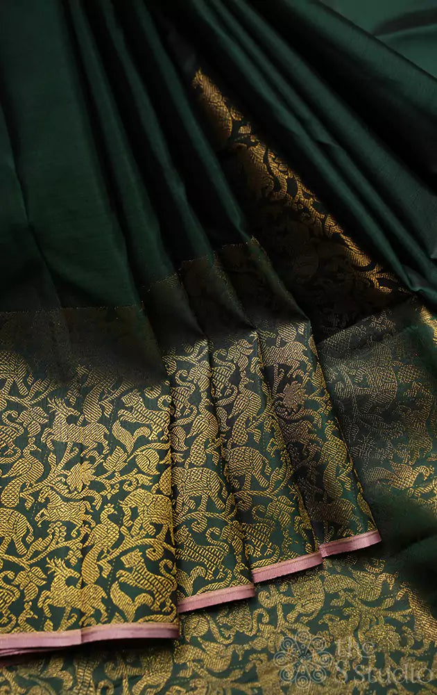 Green kanchipuram silk saree with vanasingharm border
