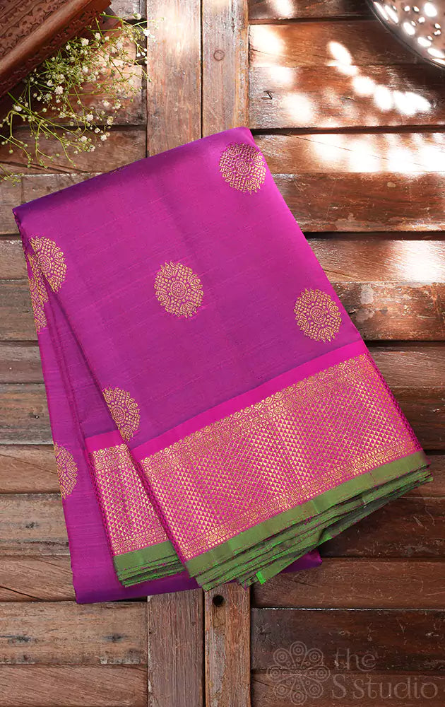 Purple kanchipuram silk saree with rani pink border
