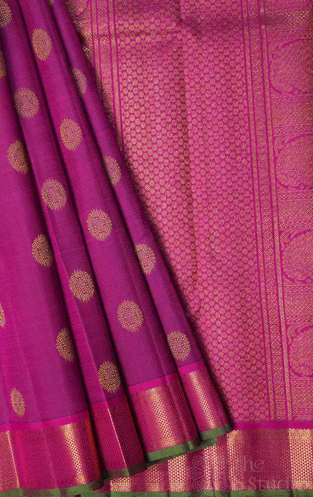 Purple kanchipuram silk saree with rani pink border