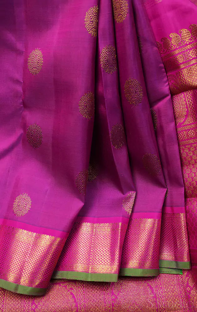 Purple kanchipuram silk saree with rani pink border