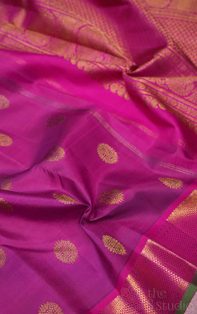 Purple kanchipuram silk saree with rani pink border